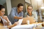 Colleagues workshopping business ideas in modern co working space